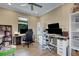 Bright home office with dual workstations, offering a functional and productive space for work or study at 5946 Caspian Tern Dr, Sarasota, FL 34238