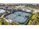 Aerial view of the community tennis courts with a gazebo and lush landscaping at 5946 Caspian Tern Dr, Sarasota, FL 34238