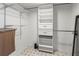 Walk in closet features custom shelving and drawer units at 6071 Fairway Ln # 1424, Bradenton, FL 34210