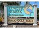 Timber Creek Condominiums sign with a heron, advertising a public Golf Par 3 course at 6071 Fairway Ln # 1424, Bradenton, FL 34210