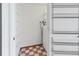 A laundry room with white walls, shelving, tiled floors, and a washer and dryer at 6071 Fairway Ln # 1424, Bradenton, FL 34210