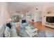 Comfortable living room with wood floors, vaulted ceiling, bright light, and access to an outdoor dining space at 6071 Fairway Ln # 1424, Bradenton, FL 34210