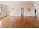 An open-concept living room with parquet flooring, and a view of the kitchen at 6071 Fairway Ln # 1424, Bradenton, FL 34210