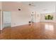 Spacious living room features parquet flooring, light paint, and vaulted ceiling with ceiling fan at 6071 Fairway Ln # 1424, Bradenton, FL 34210