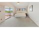 Spacious main bedroom with neutral carpet, ceiling fan, and sliding glass doors to the porch at 6071 Fairway Ln # 1424, Bradenton, FL 34210