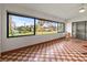 A sunroom with checkered floors, a lovely view, and an abundance of natural light at 6071 Fairway Ln # 1424, Bradenton, FL 34210