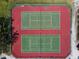 Aerial view of tennis courts with red and green playing surface at 6071 Fairway Ln # 1424, Bradenton, FL 34210