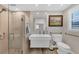 Modern bathroom features frameless shower, new fixtures, vanity, and toilet with grab bars at 6140 Midnight Pass Rd # B6, Sarasota, FL 34242