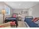 Bedroom featuring two twin beds, wood-look flooring, and neutral decor at 6140 Midnight Pass Rd # B6, Sarasota, FL 34242