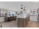 View of large open concept kitchen and dining room, with hardwood style flooring and a kitchen island at 6140 Midnight Pass Rd # B6, Sarasota, FL 34242