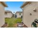 Exterior of a home with an outdoor shower and green lawn between two houses at 6140 Midnight Pass Rd # B6, Sarasota, FL 34242