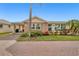 Charming single-story home featuring brick accents, lush landscaping, and a brick-paved driveway at 6140 Midnight Pass Rd # B6, Sarasota, FL 34242