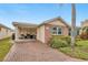 Charming single-story home featuring brick accents, lush landscaping, and a brick-paved driveway at 6140 Midnight Pass Rd # B6, Sarasota, FL 34242