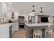 Modern kitchen with stainless steel appliances, center island, and white cabinets at 6140 Midnight Pass Rd # B6, Sarasota, FL 34242