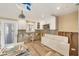 Under-construction kitchen with white cabinets, stainless microwave, tile backsplash and wood-look flooring at 6140 Midnight Pass Rd # B6, Sarasota, FL 34242