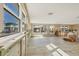 Bright living room featuring large windows and light wood-look floors during renovation at 6140 Midnight Pass Rd # B6, Sarasota, FL 34242