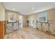 Room under renovation with insulated walls, new floors, and natural light at 6140 Midnight Pass Rd # B6, Sarasota, FL 34242