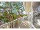 Private balcony with railings overlooking lush greenery and offering natural light and tranquil views at 6537 Gulf Of Mexico Dr, Longboat Key, FL 34228