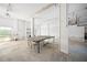 Spacious basement with a ping pong table under the bright lights, offering room for entertainment at 6537 Gulf Of Mexico Dr, Longboat Key, FL 34228