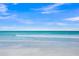 Beautiful ocean view with clear turquoise water and gentle waves on a white sandy beach at 6537 Gulf Of Mexico Dr, Longboat Key, FL 34228