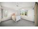 Bright bedroom boasts a vaulted ceiling, neutral carpeting, and picturesque window views at 6537 Gulf Of Mexico Dr, Longboat Key, FL 34228