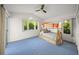 Spacious bedroom features blue carpeting and a wooden bunk bed beside picturesque windows at 6537 Gulf Of Mexico Dr, Longboat Key, FL 34228