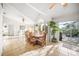 Bright dining room with tile floors and large windows providing seamless indoor-outdoor living at 6537 Gulf Of Mexico Dr, Longboat Key, FL 34228