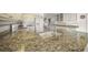 Spacious kitchen featuring granite countertops, white cabinets, and stainless steel appliances at 6537 Gulf Of Mexico Dr, Longboat Key, FL 34228