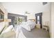 Bright main bedroom with ceiling fan, walk-out to a balcony, and comfortable furnishings at 6537 Gulf Of Mexico Dr, Longboat Key, FL 34228