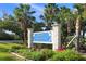 Welcome to the Town of Longboat Key sign surrounded by palm trees and lush greenery at 6537 Gulf Of Mexico Dr, Longboat Key, FL 34228