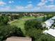 Expansive aerial view of the community golf course with trees, ponds, and residential homes at 6726 Fairview Ter # 6726, Bradenton, FL 34203