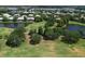 Aerial view of homes surrounded by lush landscaping, golf course, and scenic water features at 6726 Fairview Ter # 6726, Bradenton, FL 34203