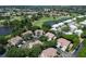 Aerial view of community featuring golf course, ponds, and mature trees at 6726 Fairview Ter # 6726, Bradenton, FL 34203