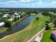 Aerial view of the community featuring beautiful ponds, lush landscaping, and nearby homes at 6726 Fairview Ter # 6726, Bradenton, FL 34203