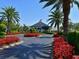 Clubhouse entrance, a well-manicured landscape and an American flag at 6726 Fairview Ter # 6726, Bradenton, FL 34203
