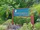 Community sign for Fairway Gardens at Tara surrounded by lush landscaping at 6726 Fairview Ter # 6726, Bradenton, FL 34203