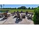 Community fire pit area, with Adirondack chairs surrounding the space for outdoor enjoyment at 6726 Fairview Ter # 6726, Bradenton, FL 34203