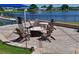 Community fire pit area with Adirondack chairs, offering a cozy outdoor gathering spot and water view at 6726 Fairview Ter # 6726, Bradenton, FL 34203