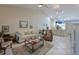 Spacious living room features tile floors, high ceilings, and access to the kitchen at 6726 Fairview Ter # 6726, Bradenton, FL 34203