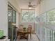 Enclosed patio featuring tile floors and a dining table perfect for outdoor meals at 6726 Fairview Ter # 6726, Bradenton, FL 34203