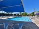 Large, well-maintained swimming pool with plenty of lounge chairs and shaded areas at 6726 Fairview Ter # 6726, Bradenton, FL 34203