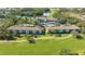 Aerial view of a multi-Gathering residential complex near a pond, pool, and golf course at 8755 Olde Hickory Ave # 7204, Sarasota, FL 34238