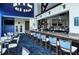 A well-stocked bar features an oval chandelier, comfortable seating, and a wide selection of beverages at 8755 Olde Hickory Ave # 7204, Sarasota, FL 34238