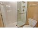 Tiled shower with clear glass door next to the toilet at 8755 Olde Hickory Ave # 7204, Sarasota, FL 34238