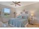 Spacious bedroom with a relaxing view of the greens at 8755 Olde Hickory Ave # 7204, Sarasota, FL 34238