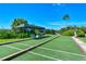 Bocce ball court with covered seating in a lushly landscaped area at 8755 Olde Hickory Ave # 7204, Sarasota, FL 34238