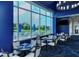 An elegant dining area boasts amazing views of the golf course and community at 8755 Olde Hickory Ave # 7204, Sarasota, FL 34238
