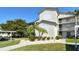 Exterior of a multi-story condominium building with manicured landscaping at 8755 Olde Hickory Ave # 7204, Sarasota, FL 34238