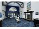 Welcoming lobby features high ceilings, an elegant fireplace, and comfortable seating for residents and guests at 8755 Olde Hickory Ave # 7204, Sarasota, FL 34238
