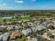 An aerial view of a well-maintained neighborhood featuring a golf course, lakes, lush greenery, and beautiful homes at 10030 Reagan Dairy Trl, Bradenton, FL 34212